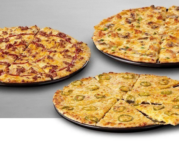 3 Large pizzas on black plates